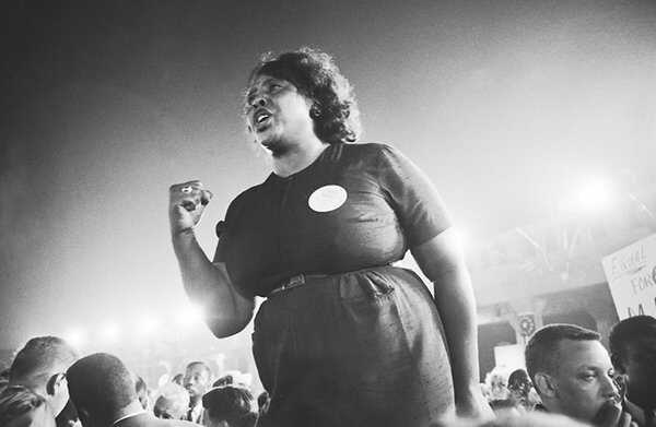 black and white photo of Fannie Lou Hamer speaking spiritedly to a crowd